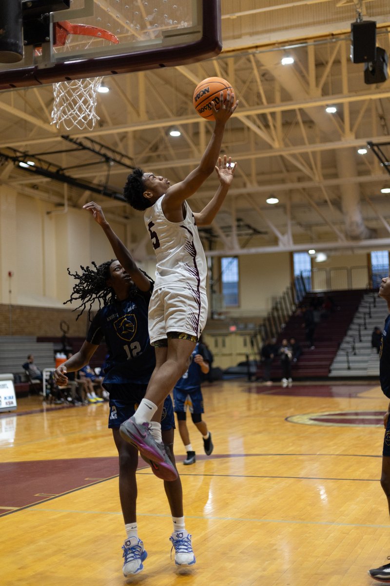Basketball player going up for a layup